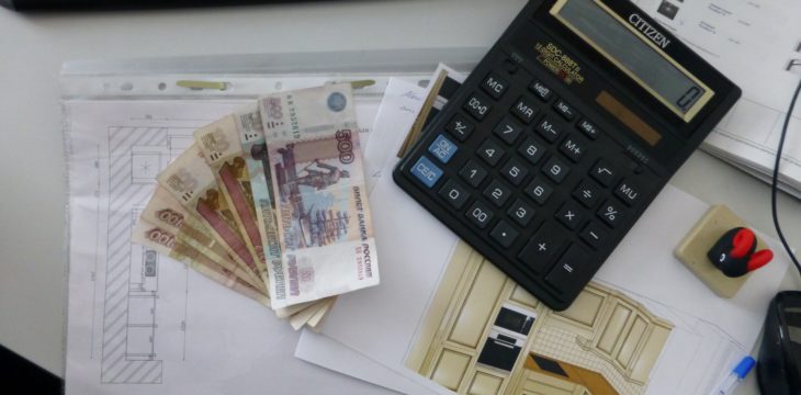 money, calculator, and a keyboard