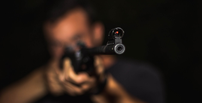 a shooter aiming a target