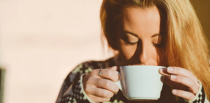 woman taking coffee